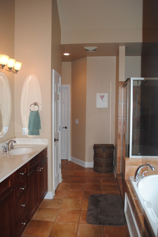 Master bath has double sinks, vaulted ceiling, a jetted garden tub and title=