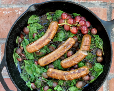 Italian Sausage with Grapes & Greens, another Quick Supper @ KitchenParade.com, healthy sausages cooked with onions and grapes (or cherries! or blackberries!) glazed with balsamic vinegar.