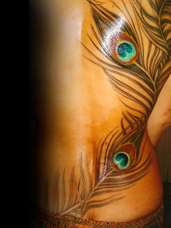 Awesome feather fantasy tattoo on side body