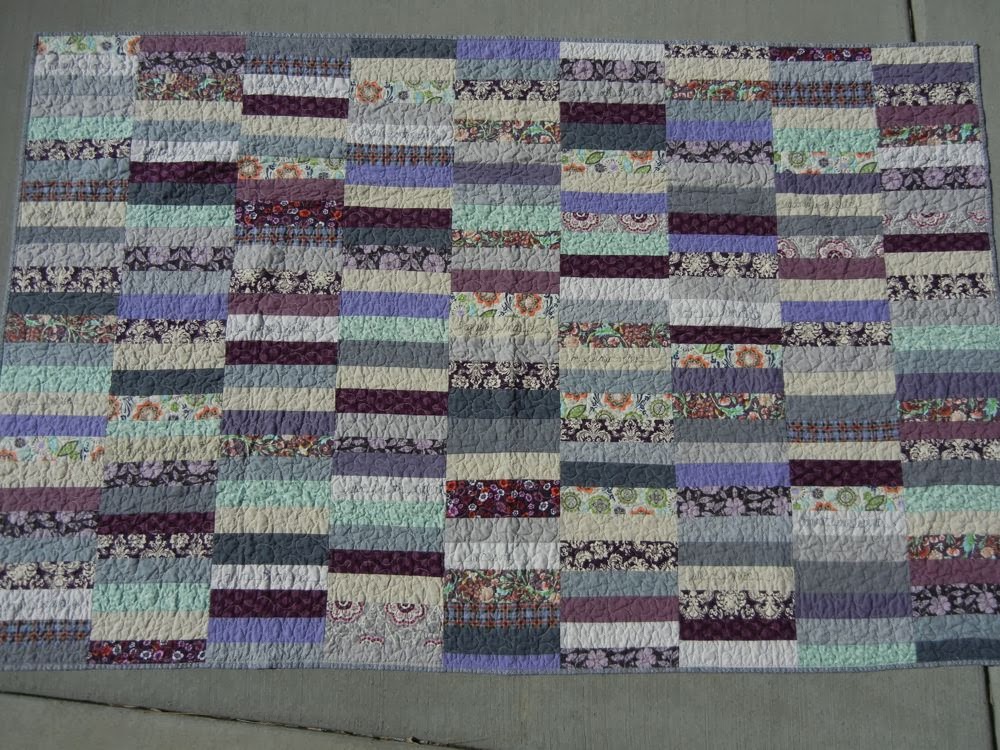 Baumcat Healing quilt in purples and gray