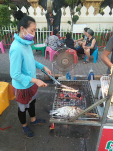 Preparation of "Barbecue Food" on pavement of "Night Market" street.
