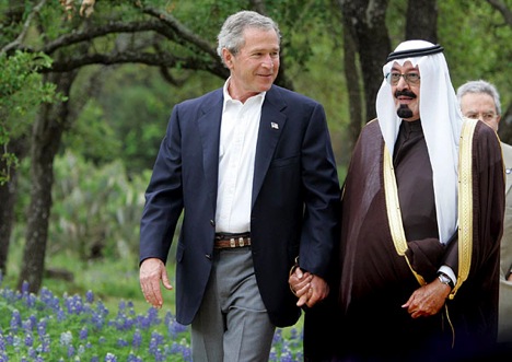 two people walking holding pictures of people holding hands around. two people walking holding
