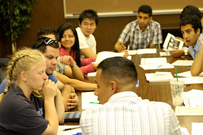 College students studying together. College environment sometimes require self defense weapons.