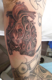 Anatomical Realistic Heart Tattoo Design on Arm