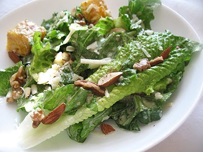 vegetarian Caesar salad with toasted nuts and fine quality olive oil and vinegar