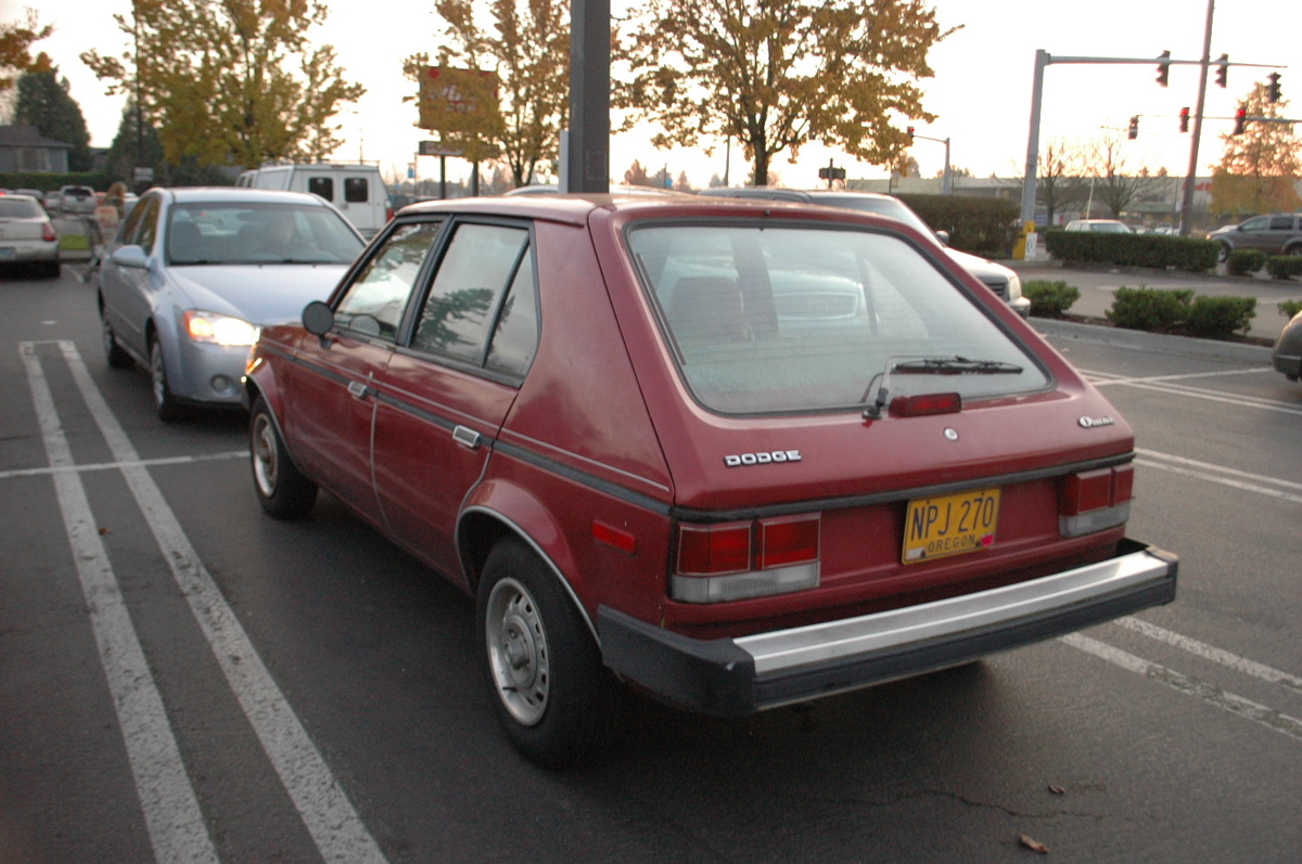 OLD PARKED CARS. 1986 Dodge Omni.