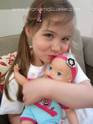 kissing baby doll