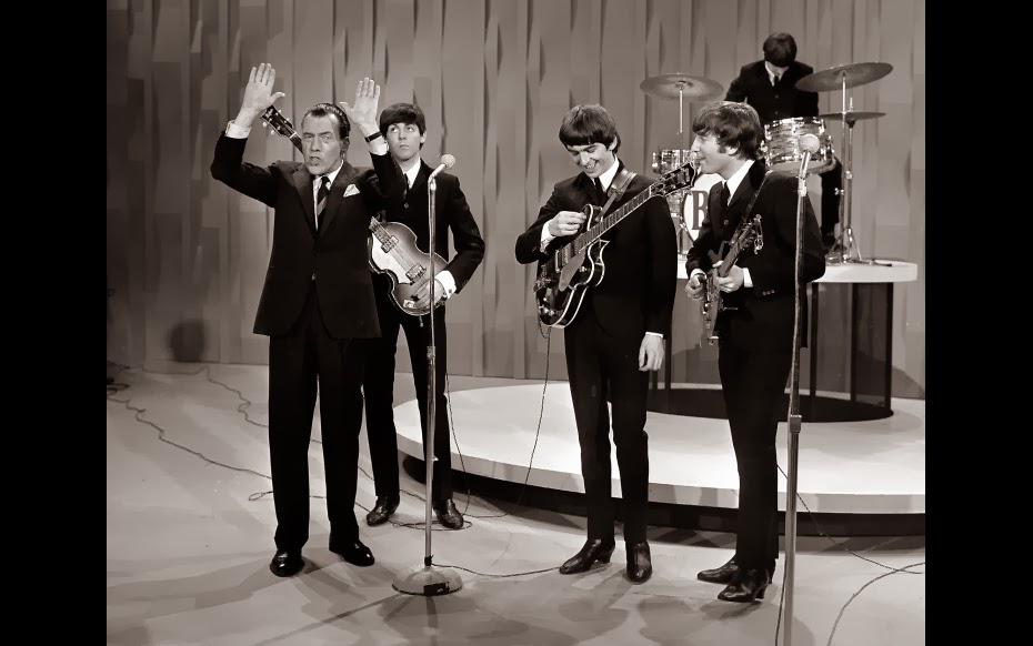 The Beatles with Ed Sullivan during their historic debut performance on "The Ed Sullivan Show" on Feb. 9, 1964
