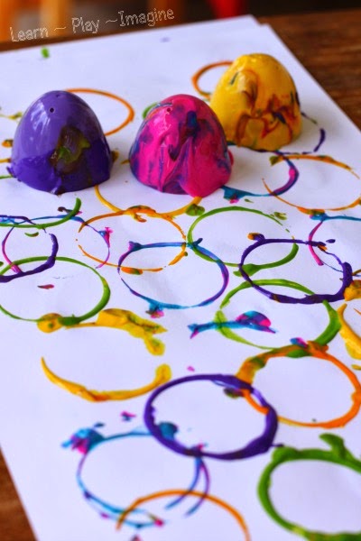 Painting with plastic Easter eggs - a fun and frugal way to explore print making.  Bonus:  it builds fine motor skills!