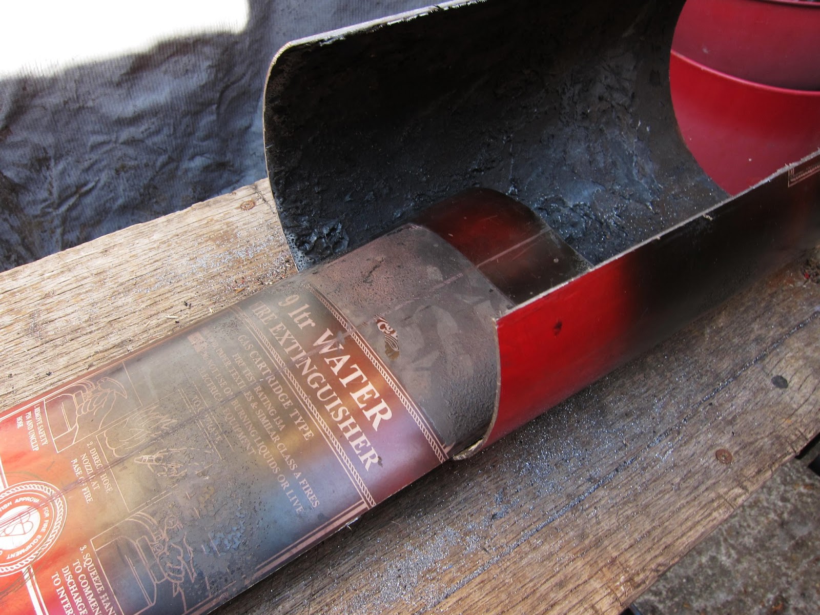 Fire extinguisher wood stove