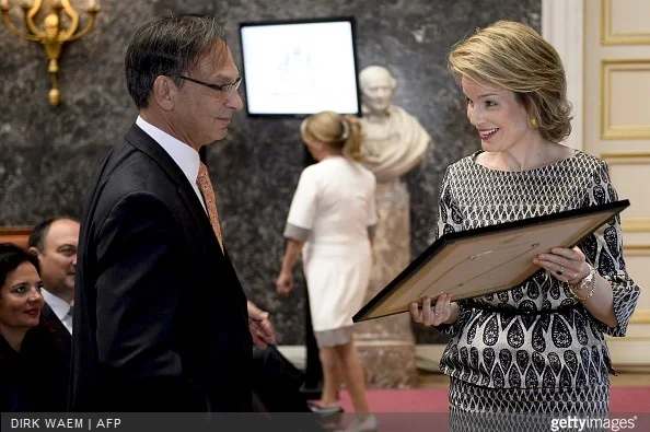 Queen Mathilde of Belgium speaks with Professor Bruce Spiegelman who received the 2015 scientific health prize from the Artois-Baillet Latour Foundation during a ceremony for the Inbev-Baillet Latour awards for Health and Clinical Research in Brussels