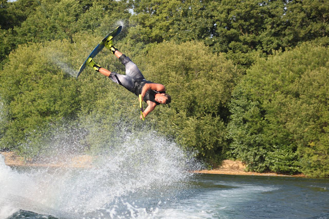 Amazing rider performing a move in the air to the left, upside down