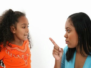 A parent scolding a child as a form of punishment. A parent scolding a child as a form of punishment.