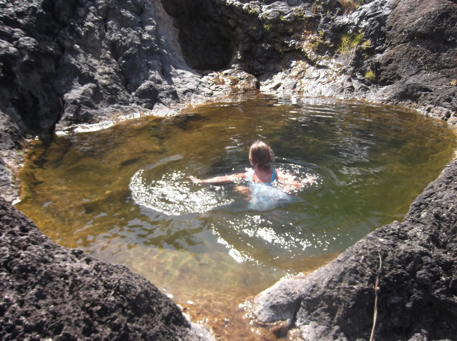 tipping guam over Priest's Pools and Merizo Pier