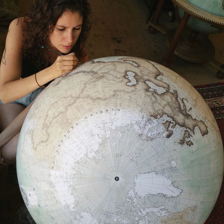 Isis started painting around the coastlines in England and is working her way around Cambodia, Vietnam & towards the Americas - One Of The World’s Last Remaining Globe-Makers That Use The Ancient Art Of Making Globes By Hand Isis started painting around the coastlines in England and is working her way around Cambodia, Vietnam & towards the Americas - One Of The World’s Last Remaining Globe-Makers That Use The Ancient Art Of Making Globes By Hand