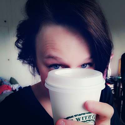 girl drinking a latte, latte, brunette, blue eyes
