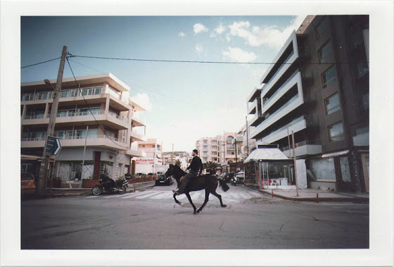 dirty photos - Once - street photo of man riding a horse in crete