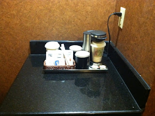 a tray of coffee and other items on a counter