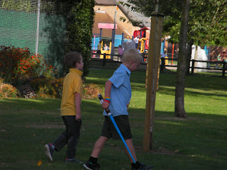 schoolboys with a light sabre