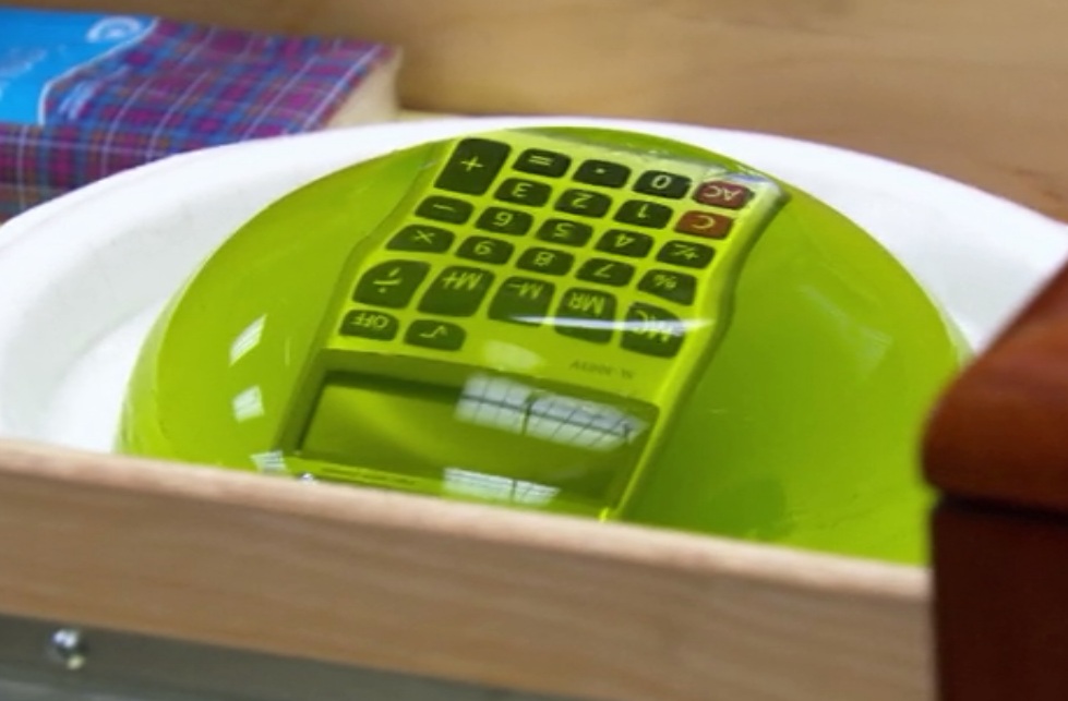 Guy holds beer for couple during Kiss Cam at CavsHawks game