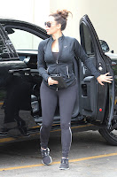 Kim Kardashian wearing black leggings