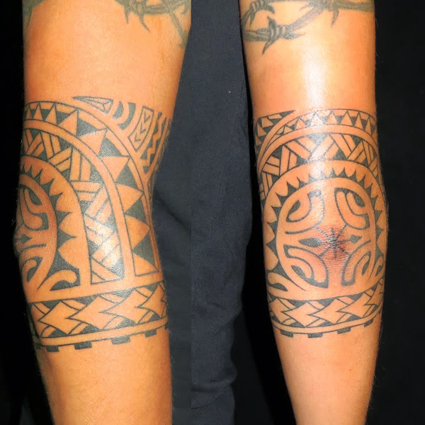 polynesian tattoo on elbow