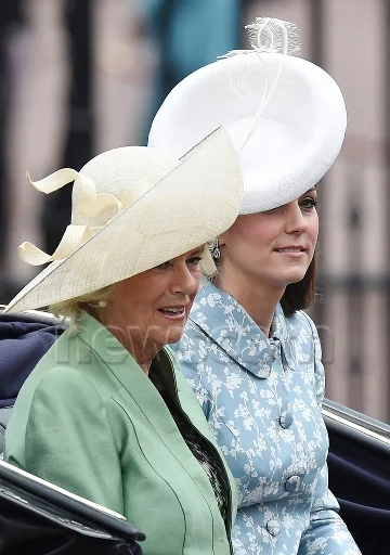 Catherine, Duchess of Cambridge and Camilla, Duchess of Cornwall as they travel in an open state carriage from Buckingham Palace