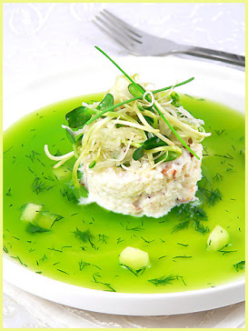 CUCUMBER JELLY TOPPING WITH CRAB CAKE MIX TOGETHER WITH ASSORTED GREEN HERBS