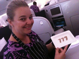 a woman holding a plate with numbers on it