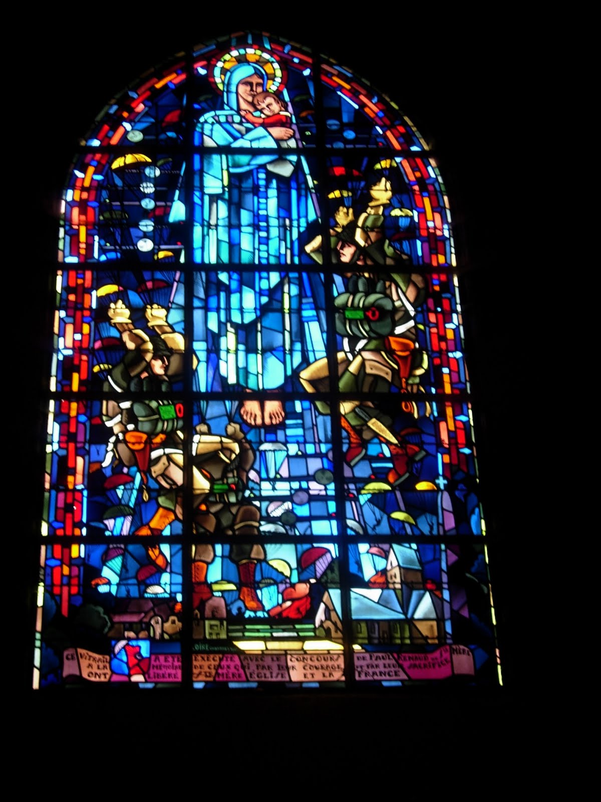 Stained glass window in a church in Sainte Mere Eglise, France