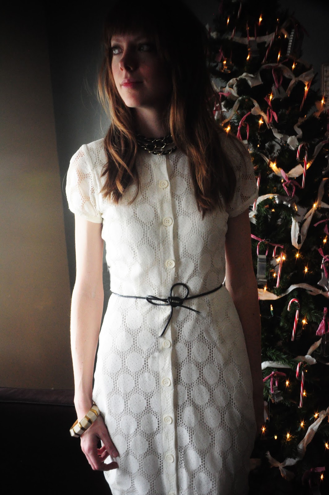 Holiday white dress with black cording bow belt