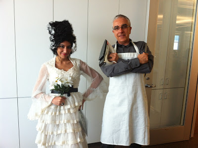 woman dressed in bride of frankenstein costume and man dressed in iron chef costume