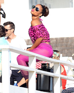 Christina Milian in pink outfit sending a kiss 
