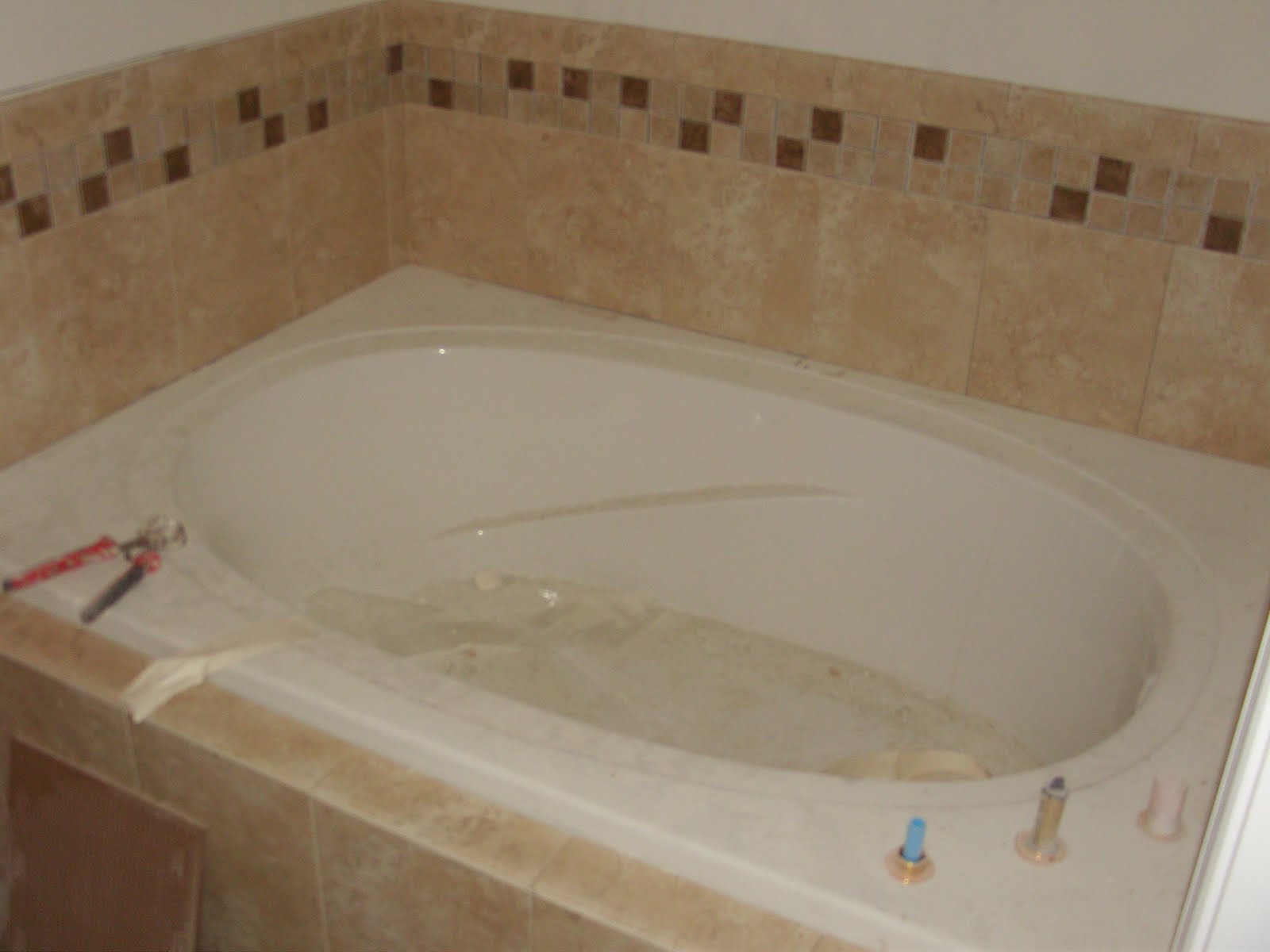 bathroom shower head Hall Bath - Tub Tile & Ivy Listello (pre-grout)