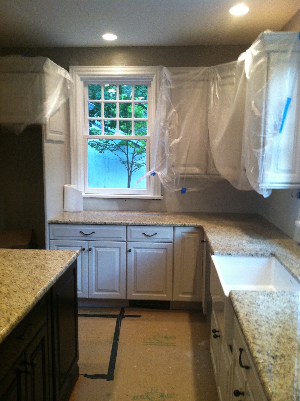 Cream colored kitchen cabinets The taps aren't in yet, but hopefully next week. I love how they've