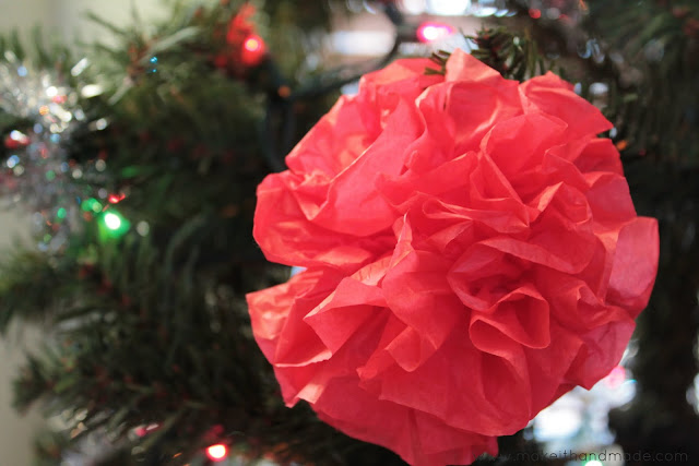 Easy Paper Pom Pom Ornament Tutorial by Make It Handmade. It only takes 2 dollars and 20 minutes to fill your tree with color!