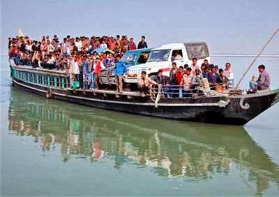 an indian ferry carrying people of assam in bramputtra river