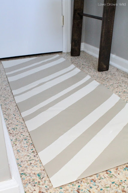 How to Make a Rug from a Drop Cloth! You can make any color, pattern, shape, or size you want for WAY less than purchasing a rug!