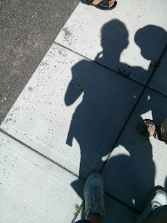 shadow on pavement of onequartermama.ca