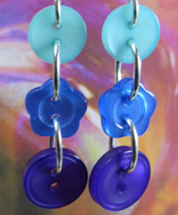 Fab Party Earrings Flattering blue dangle earrings have 3 buttons linked in long strand with silver loops