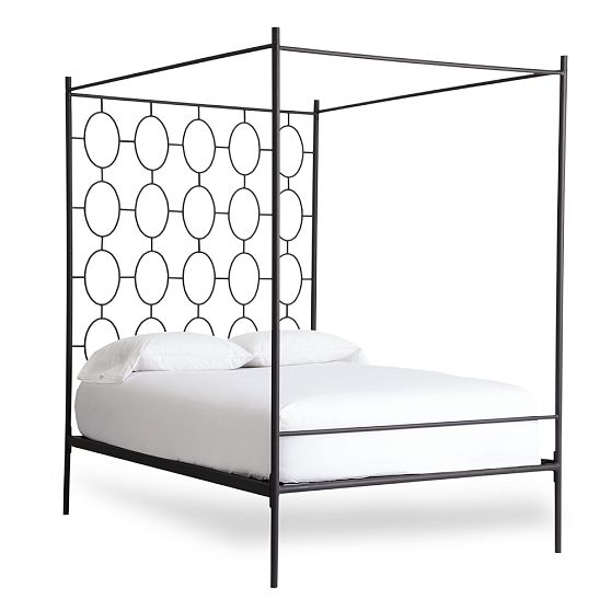 Metal powder coated canopy bed with a graphic circle pattern headboard