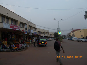 Main Entebbe Town.Fisher women selling dried and fried fish on the pavement.