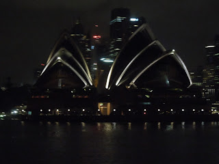 sydney opera house at night from water