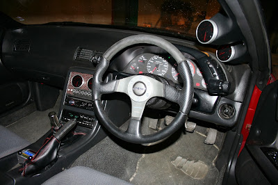 Custom Interior: 4 Defi gauges and Controller, pillar mounted, Veilside 340 km/h speedo, Momo Racing wheel, Nismo Shifter, Leather boots with Red Stitching