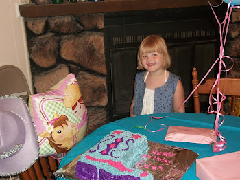 Birthday girl with her cake