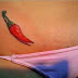 Art Tattoo feminina virilha pimenta