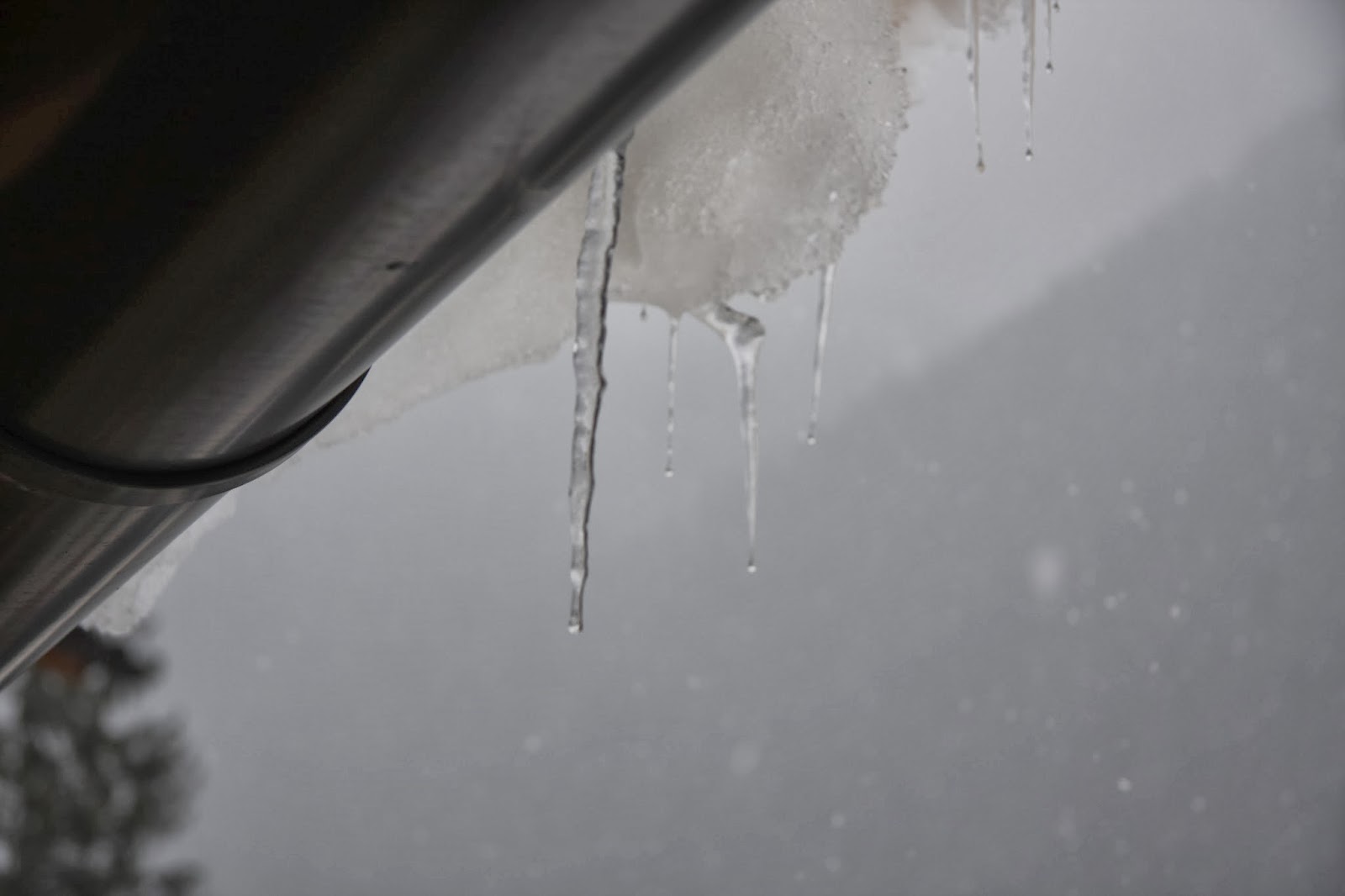 Icicles & Snow Hanging off the Roof