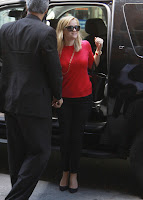 Reese Witherspoon stteping out of her black car