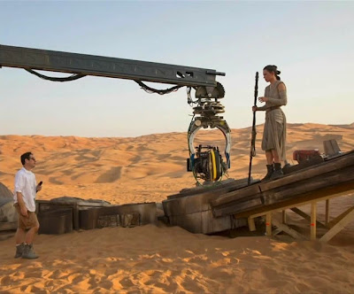 Daisy Ridley and J.J. Abrams on the set of Star Wars Episode VII: The Force Awakens