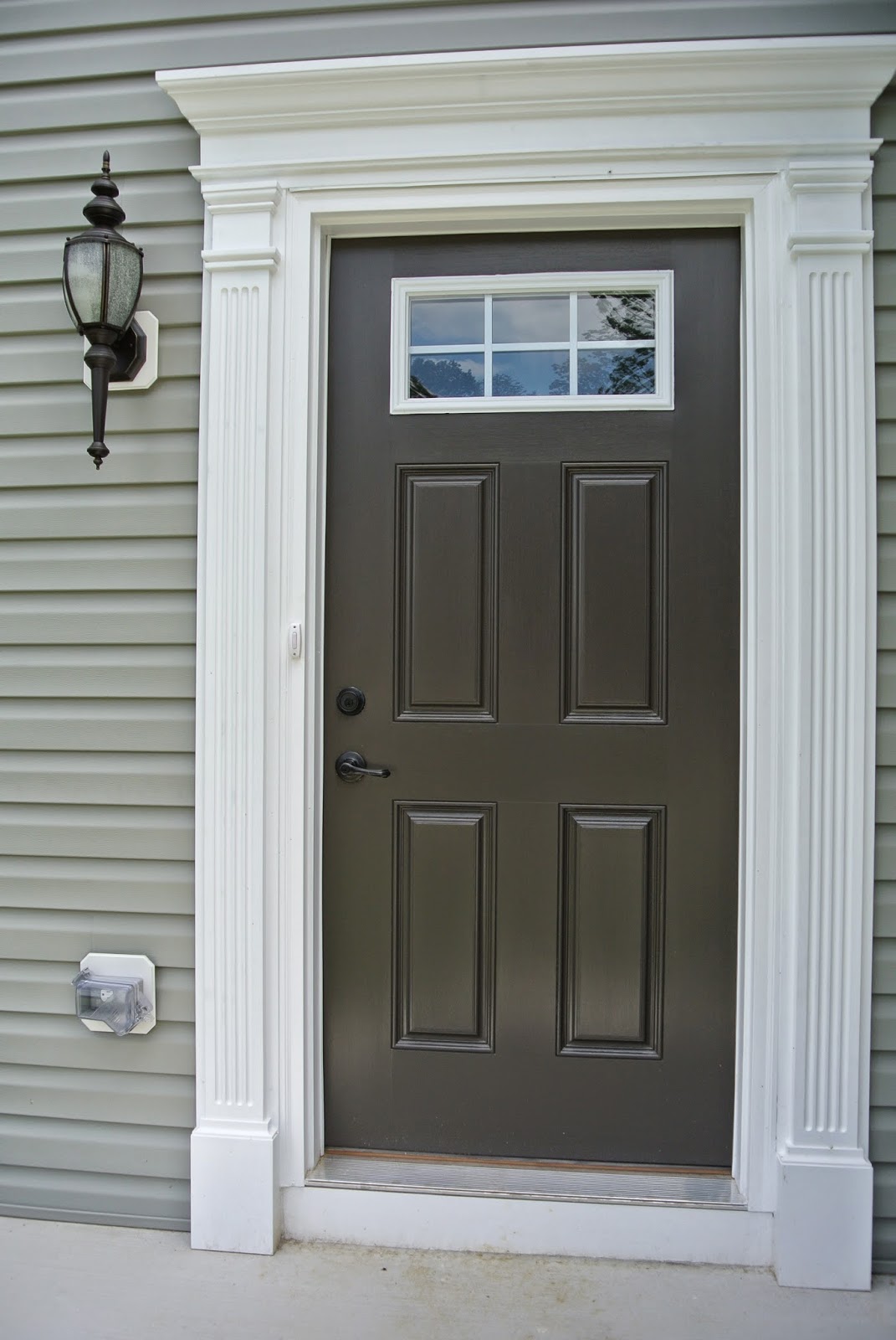 Completed Ryan Homes Florence Model Elevation A - Front Door painted in Black Fox A picture of the painted front door.